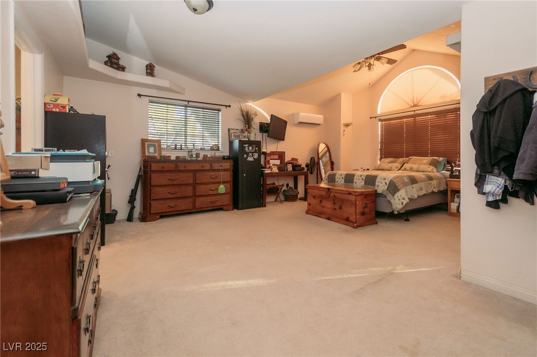 3485 Gally Road Pahrump, NV 89060 - Photo 48 of 90 Carpeted bedroom featuring lofted ceiling and a wall mounted AC