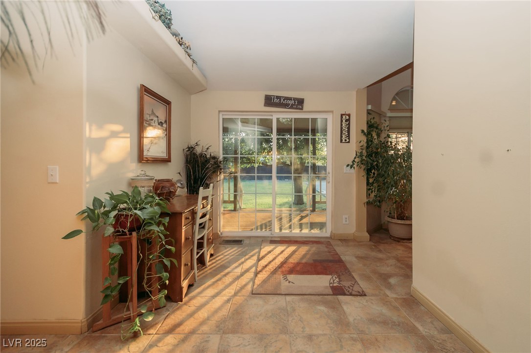 3485 Gally Road Pahrump, NV 89060 - Photo 5 of 90 Doorway featuring baseboards and stone finish floors