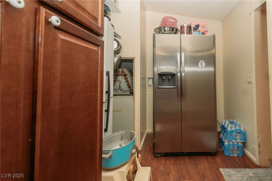 3485 Gally Road Pahrump, NV 89060 - Photo 52 of 90 Kitchen with stainless steel fridge with ice dispenser and dark wood-style flooring