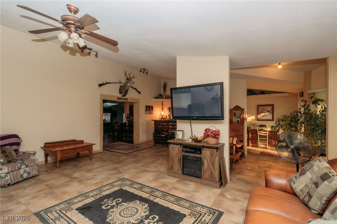 3485 Gally Road Pahrump, NV 89060 - Photo 7 of 90 Living room with a ceiling fan and lofted ceiling