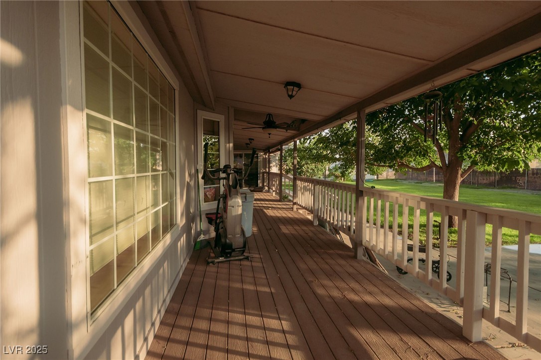 3485 Gally Road Pahrump, NV 89060 - Photo 84 of 90 Wooden porch featuring a lawn