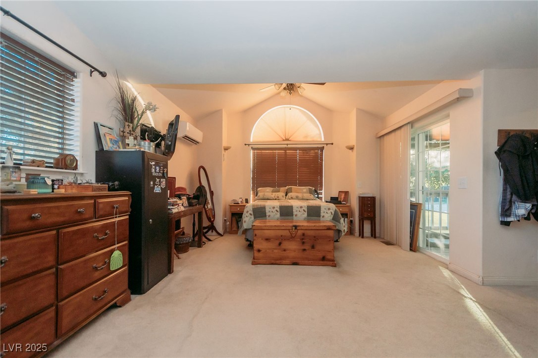 3485 Gally Road Pahrump, NV 89060 - Photo 9 of 90 Bedroom featuring carpet floors, ceiling fan, and vaulted ceiling