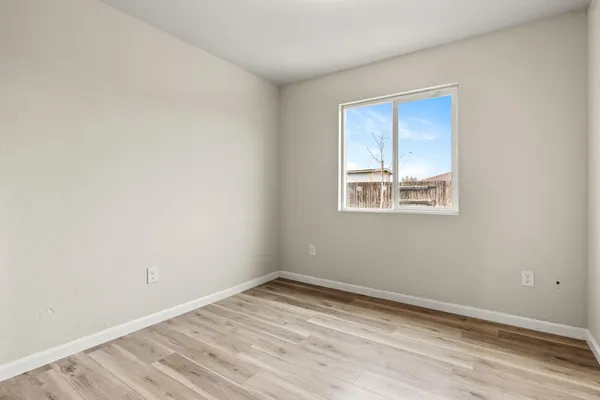 a view of a patio with table and chairs and potted plants