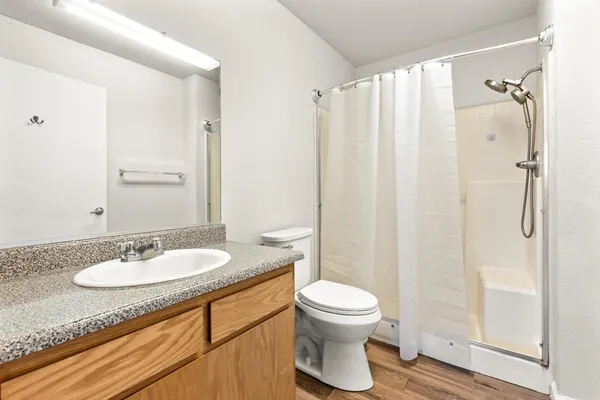 a view of a big house with a big yard and large tree