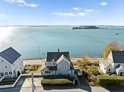 an aerial view of a house with lake view
