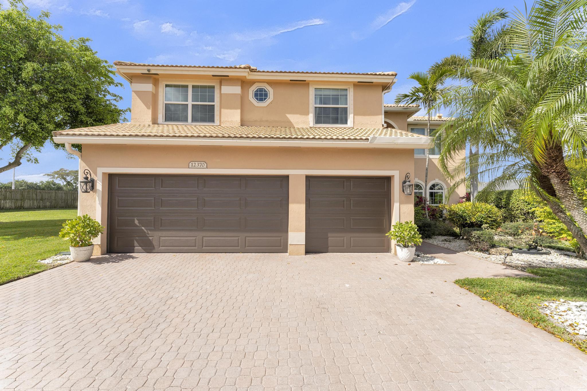 12370 St Simon Drive Boca Raton, FL 33428 - Photo 2 of 49 Morning Front View