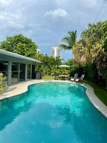 a view of house with a garden