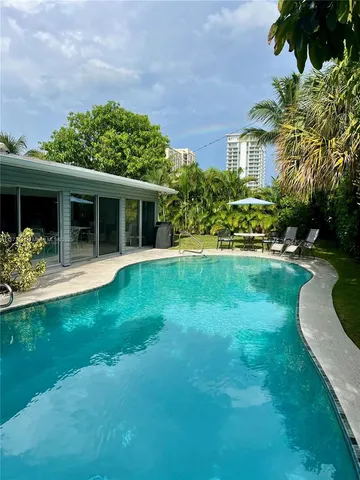 a view of a house with a yard porch and sitting area