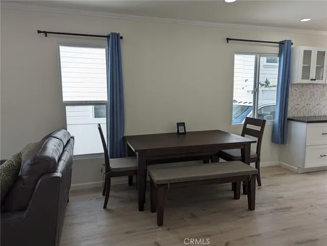 a kitchen with granite countertop a sink stove and microwave