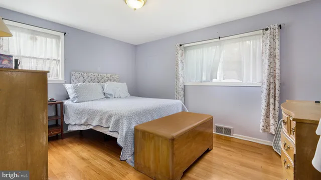 a bedroom with a bed and a tv