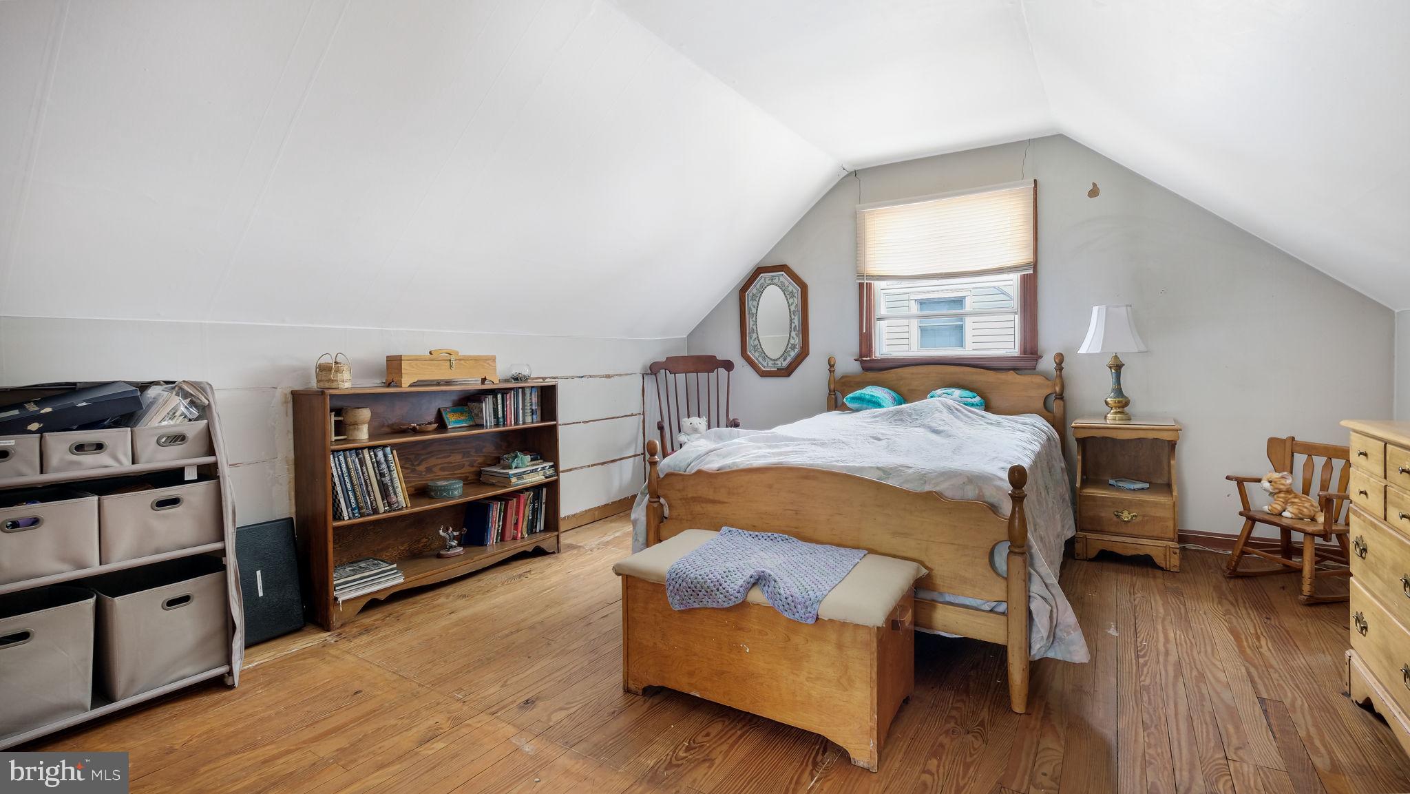 1012 Brook Avenue Secane, PA 19018 - Photo 20 of 28 a bed room with a bed and a book shelf