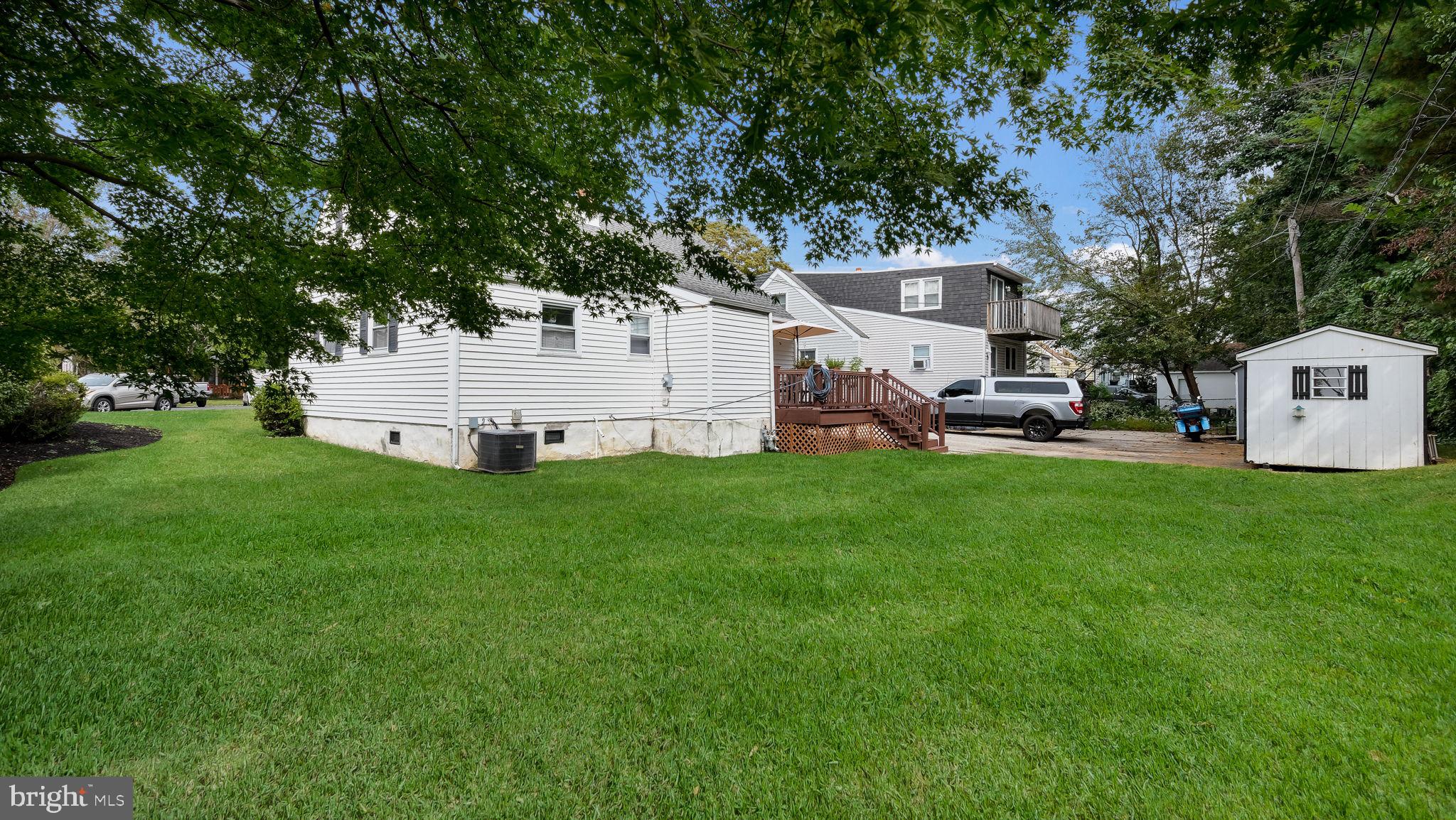 1012 Brook Avenue Secane, PA 19018 - Photo 27 of 28 a view of a white house with a yard and sitting area