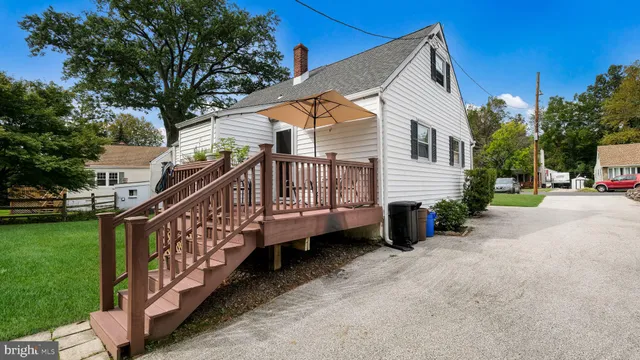 a view of a house with wooden fence