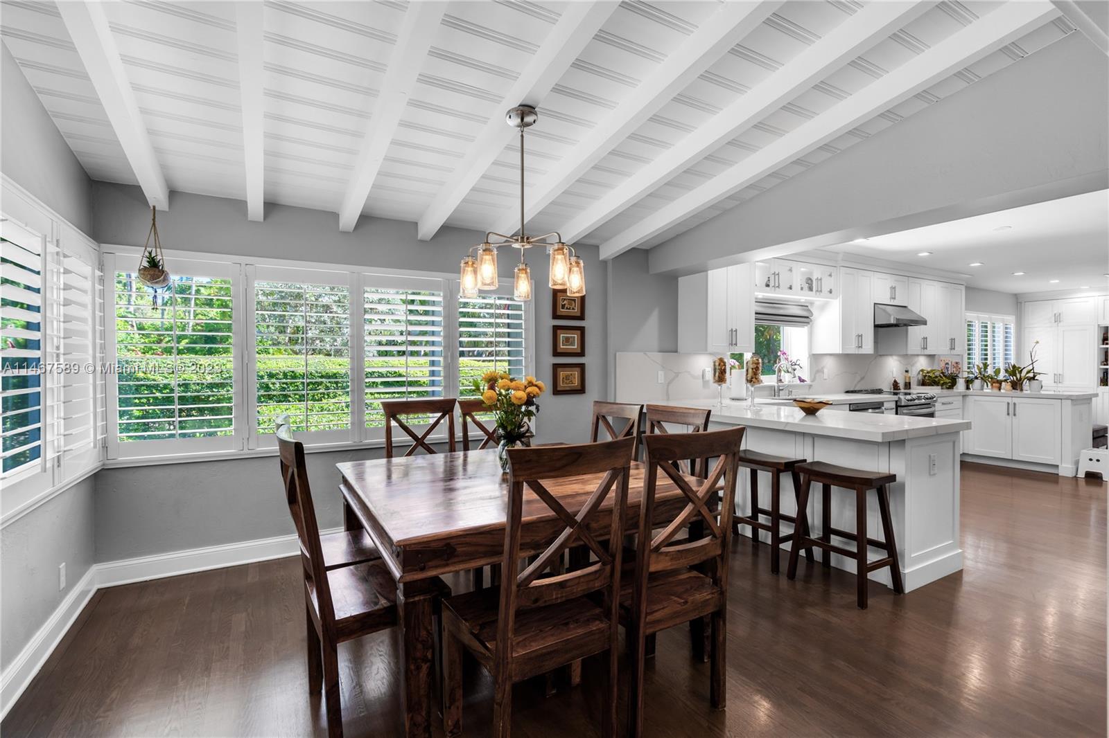 2400 Trapp Avenue Miami, FL 33133 - Photo 12 of 47 a view of a dining room with furniture window and wooden floor