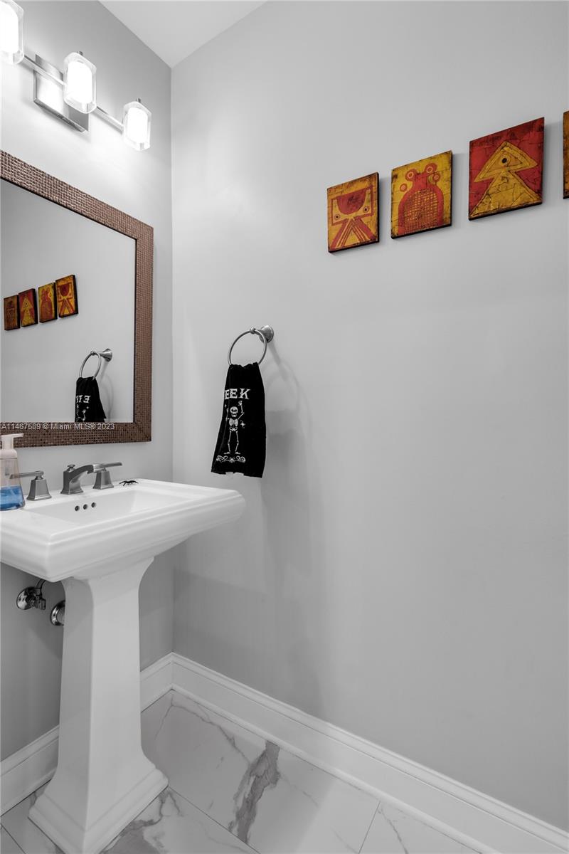 2400 Trapp Avenue Miami, FL 33133 - Photo 18 of 47 a bathroom with a sink and a mirror