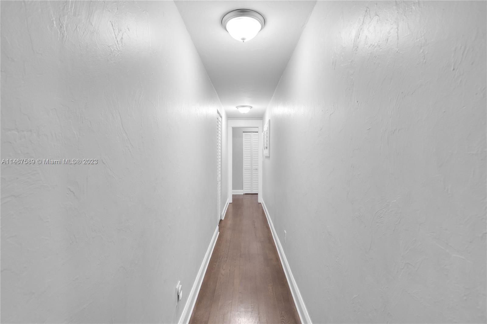 2400 Trapp Avenue Miami, FL 33133 - Photo 19 of 47 a view of a hallway with wooden floor