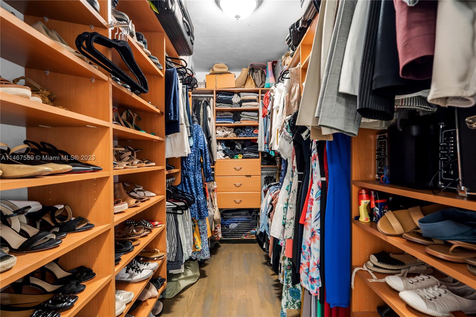 2400 Trapp Avenue Miami, FL 33133 - Photo 24 of 47 a view of walk in closet with clothes and shoes