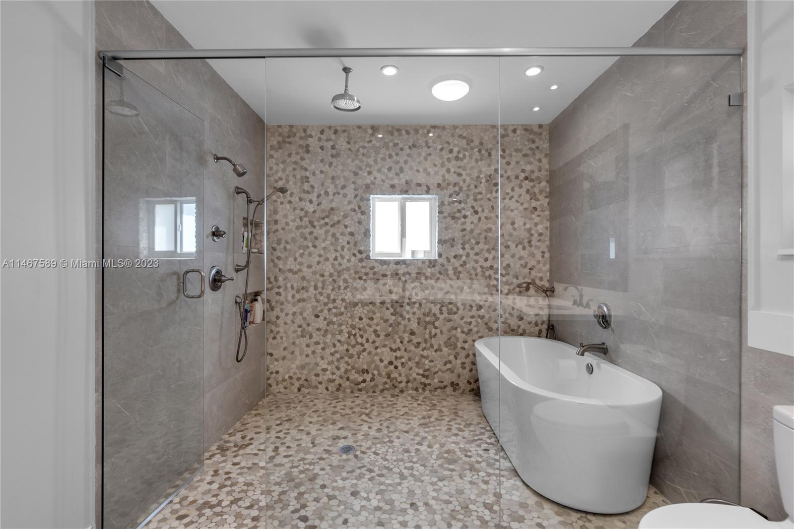 2400 Trapp Avenue Miami, FL 33133 - Photo 26 of 47 a bathroom with a bathtub and shower