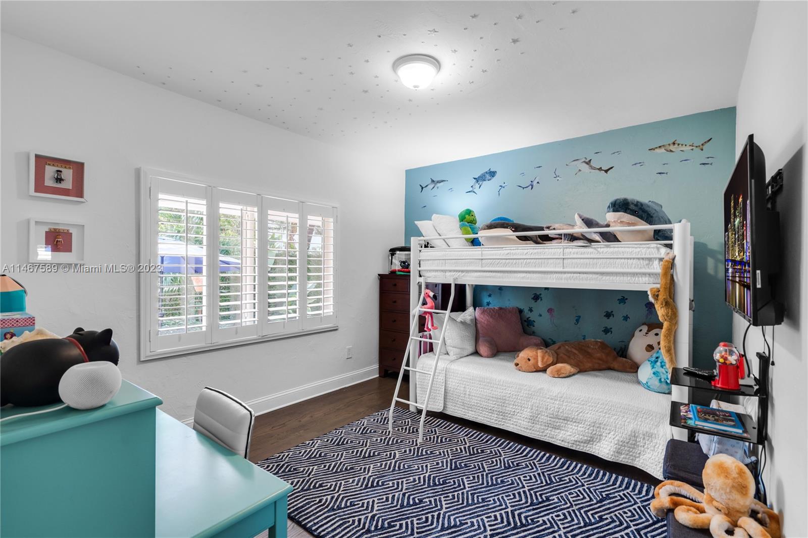 2400 Trapp Avenue Miami, FL 33133 - Photo 27 of 47 a bedroom with furniture and a window