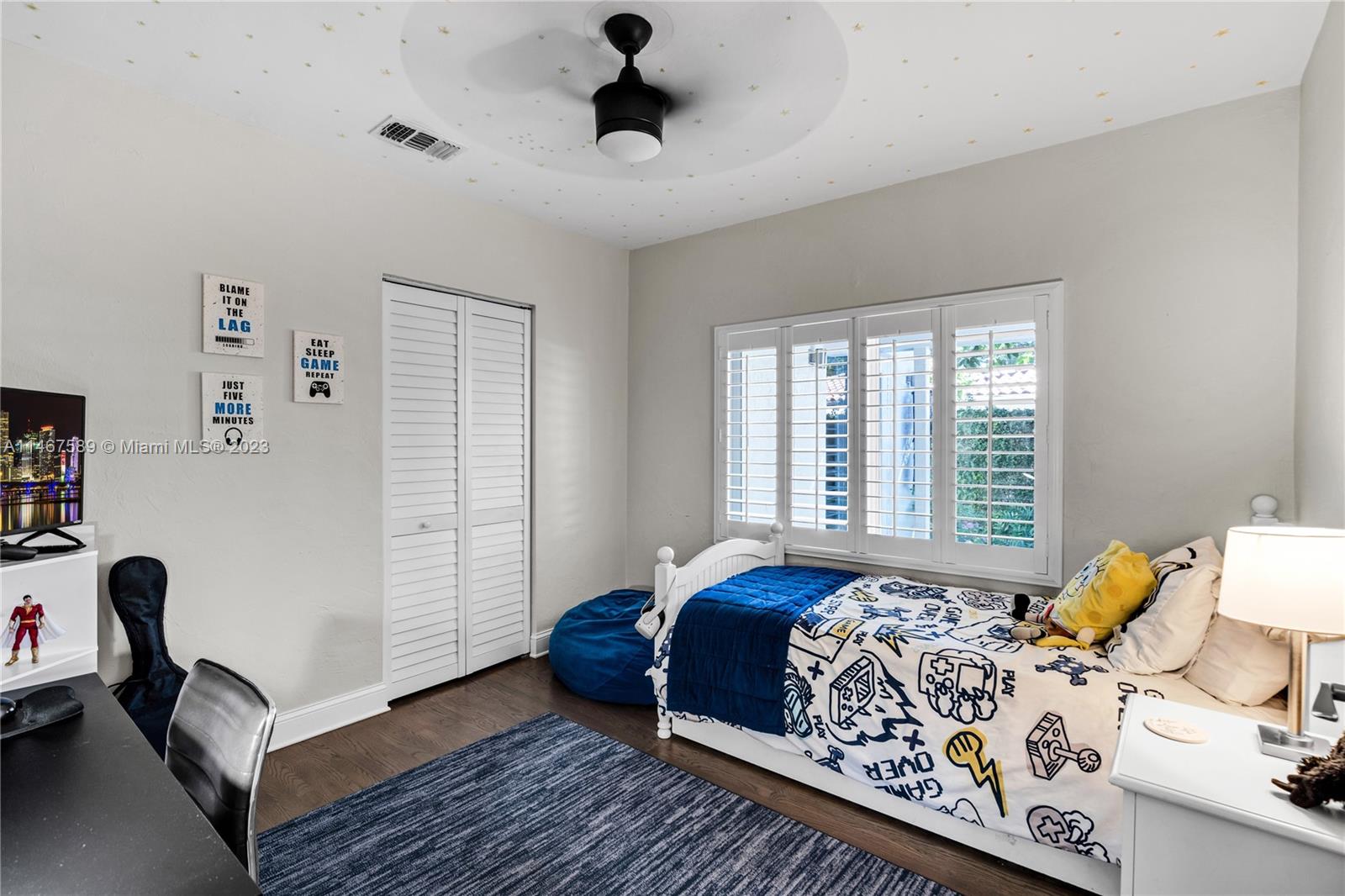 2400 Trapp Avenue Miami, FL 33133 - Photo 31 of 47 a bedroom with a bed and a window