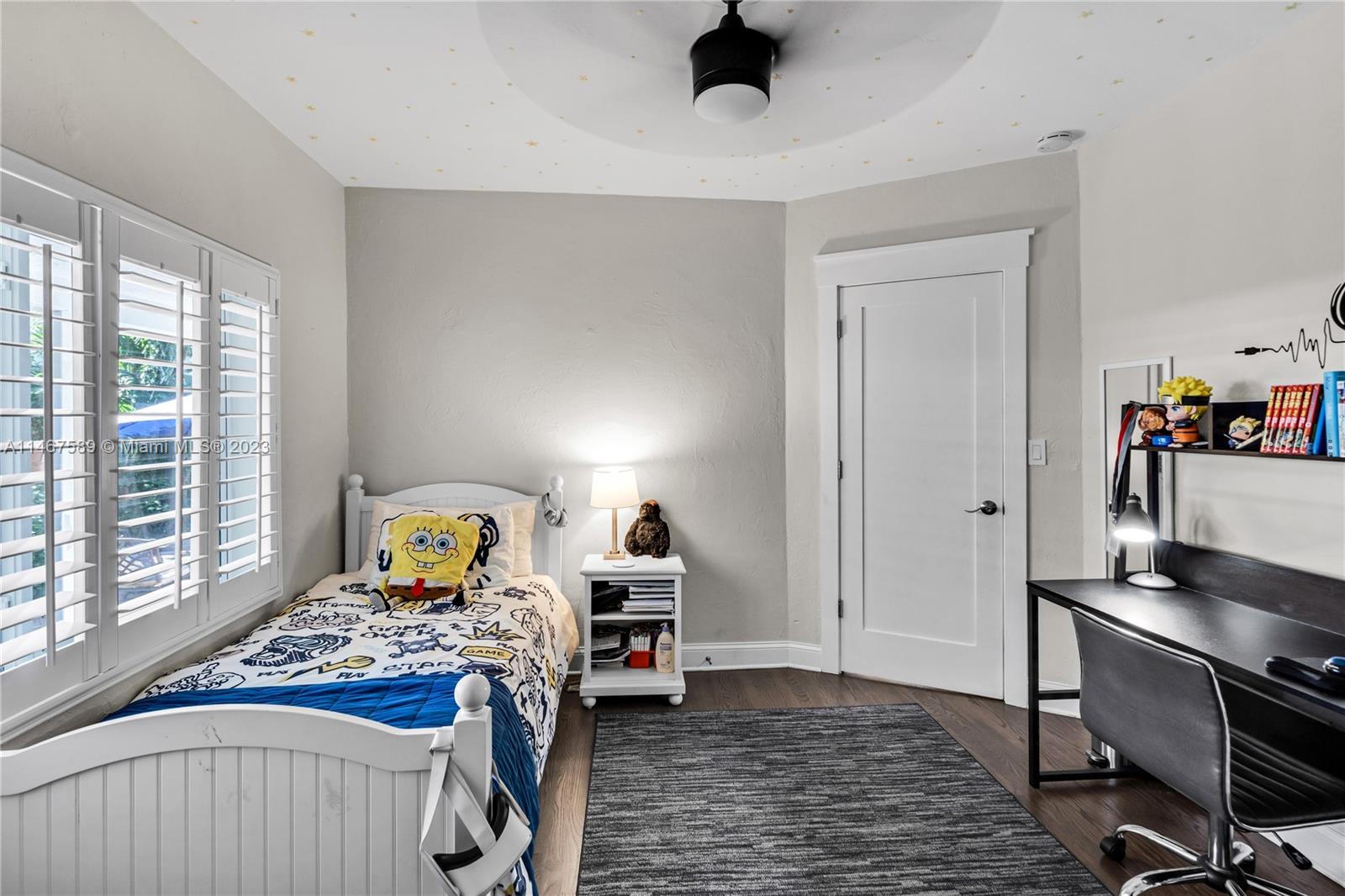 2400 Trapp Avenue Miami, FL 33133 - Photo 32 of 47 a bedroom with a bed and a window