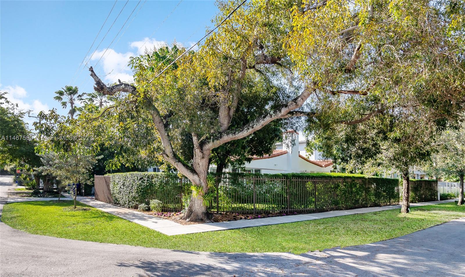 2400 Trapp Avenue Miami, FL 33133 - Photo 40 of 47 a front view of a house with a yard