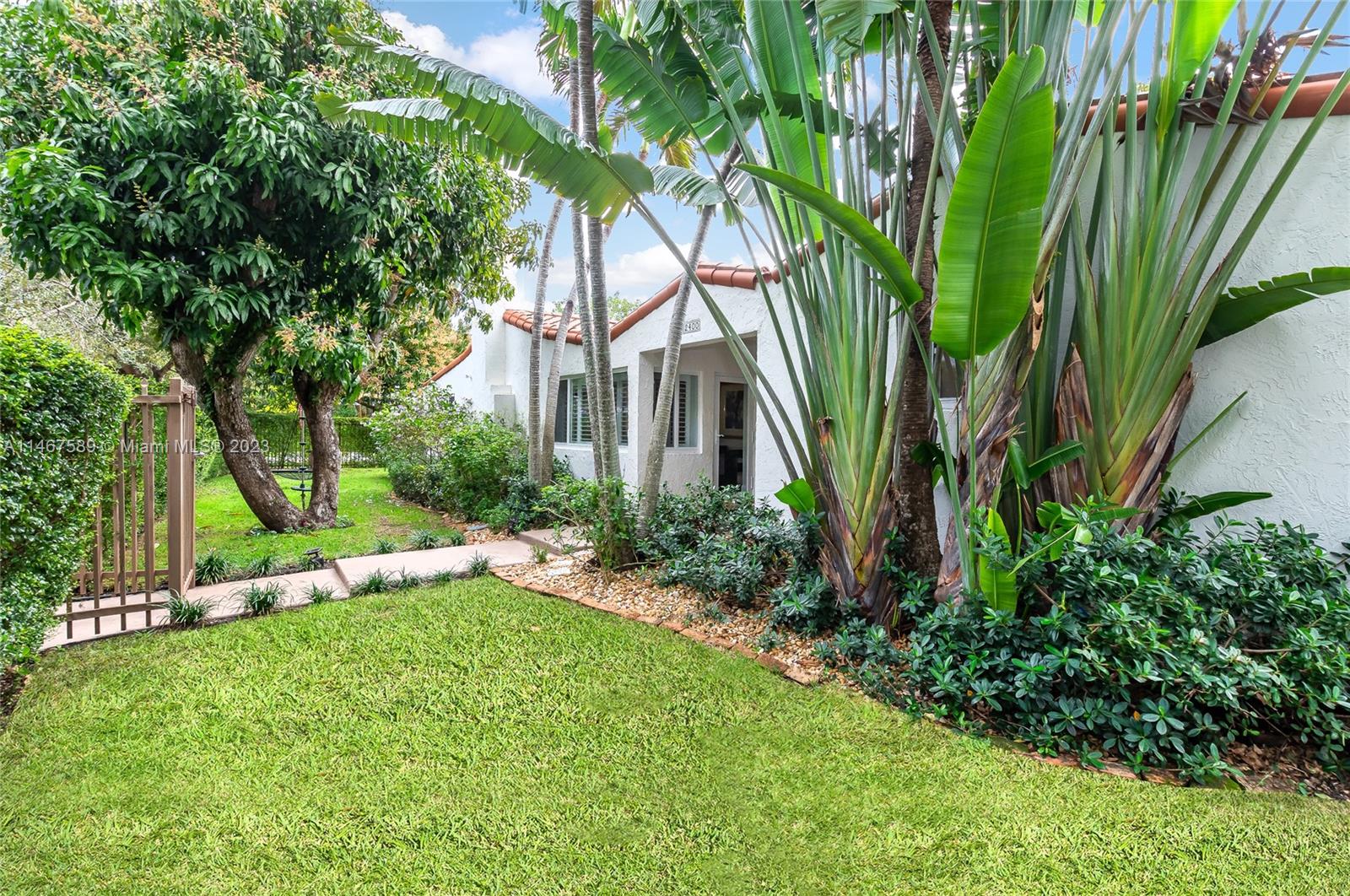 2400 Trapp Avenue Miami, FL 33133 - Photo 4 of 47 a view of an house with backyard space and garden