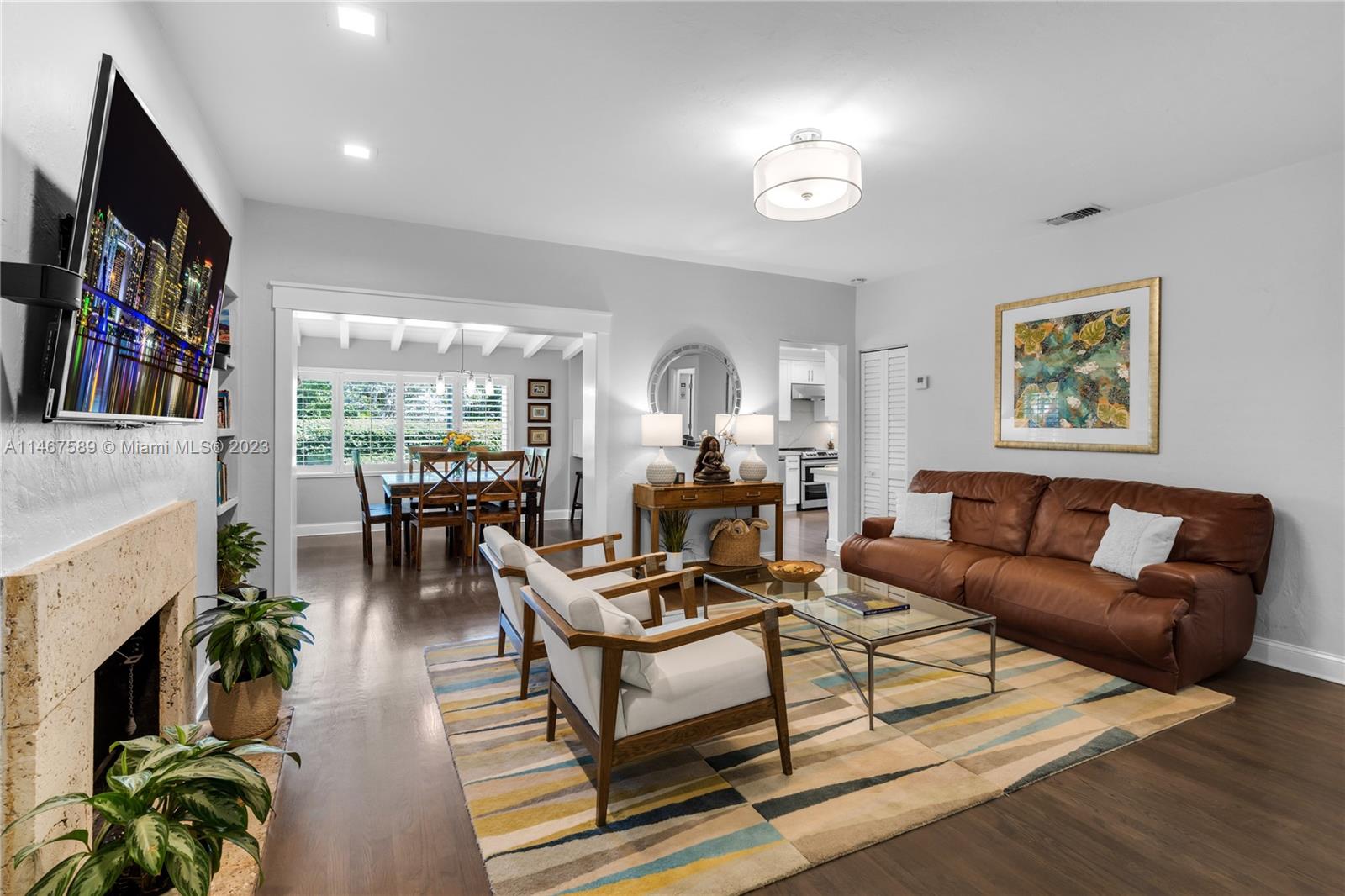 2400 Trapp Avenue Miami, FL 33133 - Photo 8 of 47 a living room with furniture fireplace and potted plants