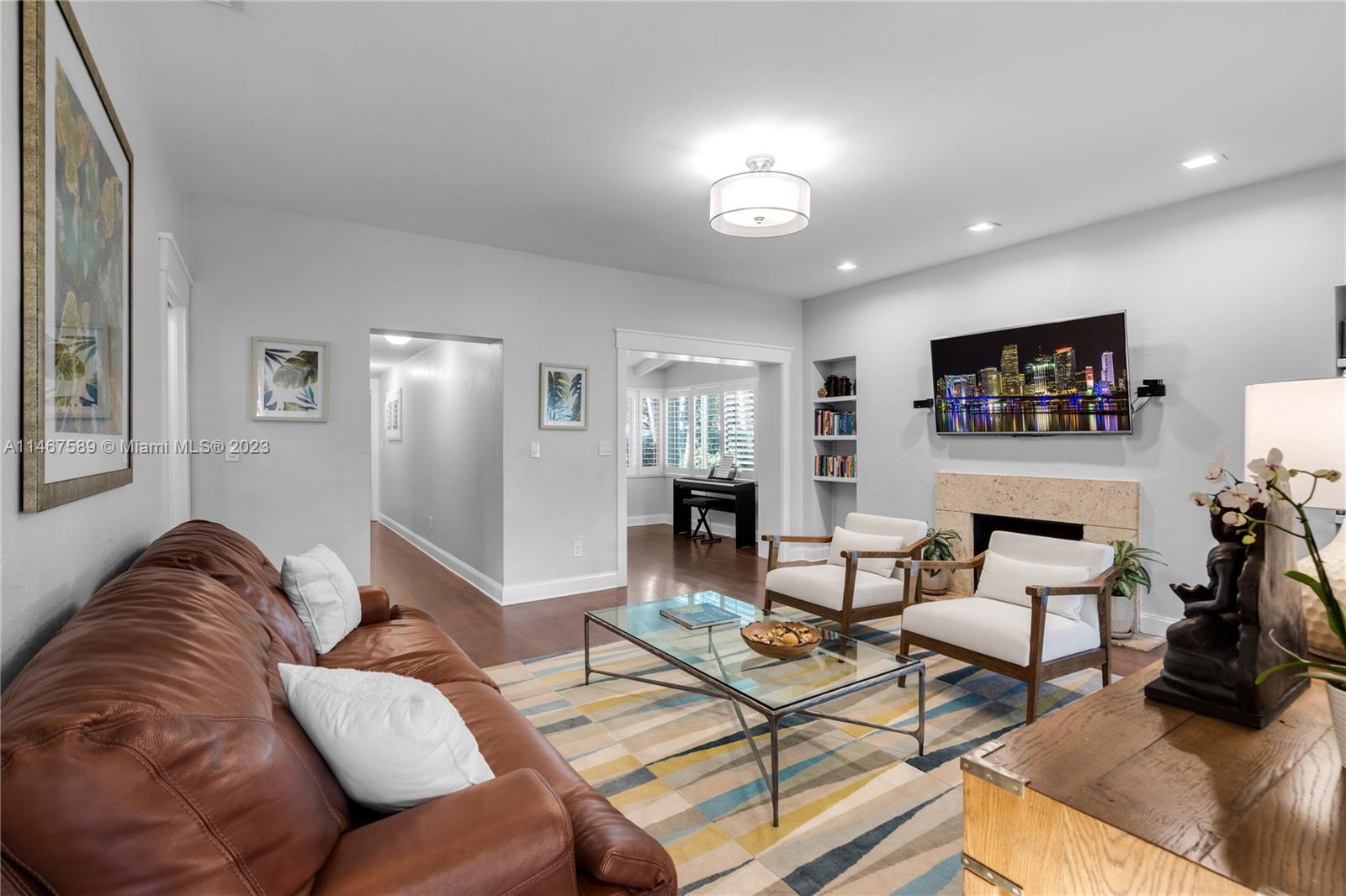 2400 Trapp Avenue Miami, FL 33133 - Photo 10 of 47 a living room with furniture and a flat screen tv