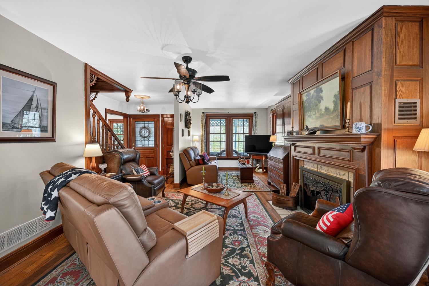 2179 Webb Road Brookville, IN 47012 - Photo 13 of 84 The living room features large windows for lots of natural light. Beautiful oak paneling surrounds the fireplace, and solid oak flooring flows thru the entire main level.