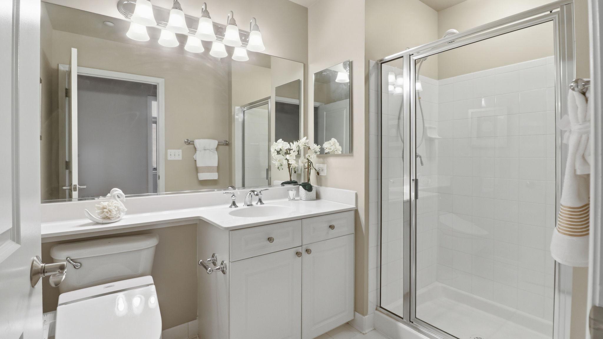 11700 Old Georgetown Road, Unit 1007 North Bethesda, MD 20852 - Photo 22 of 36 Modern elegance in a serene second full bathroom.