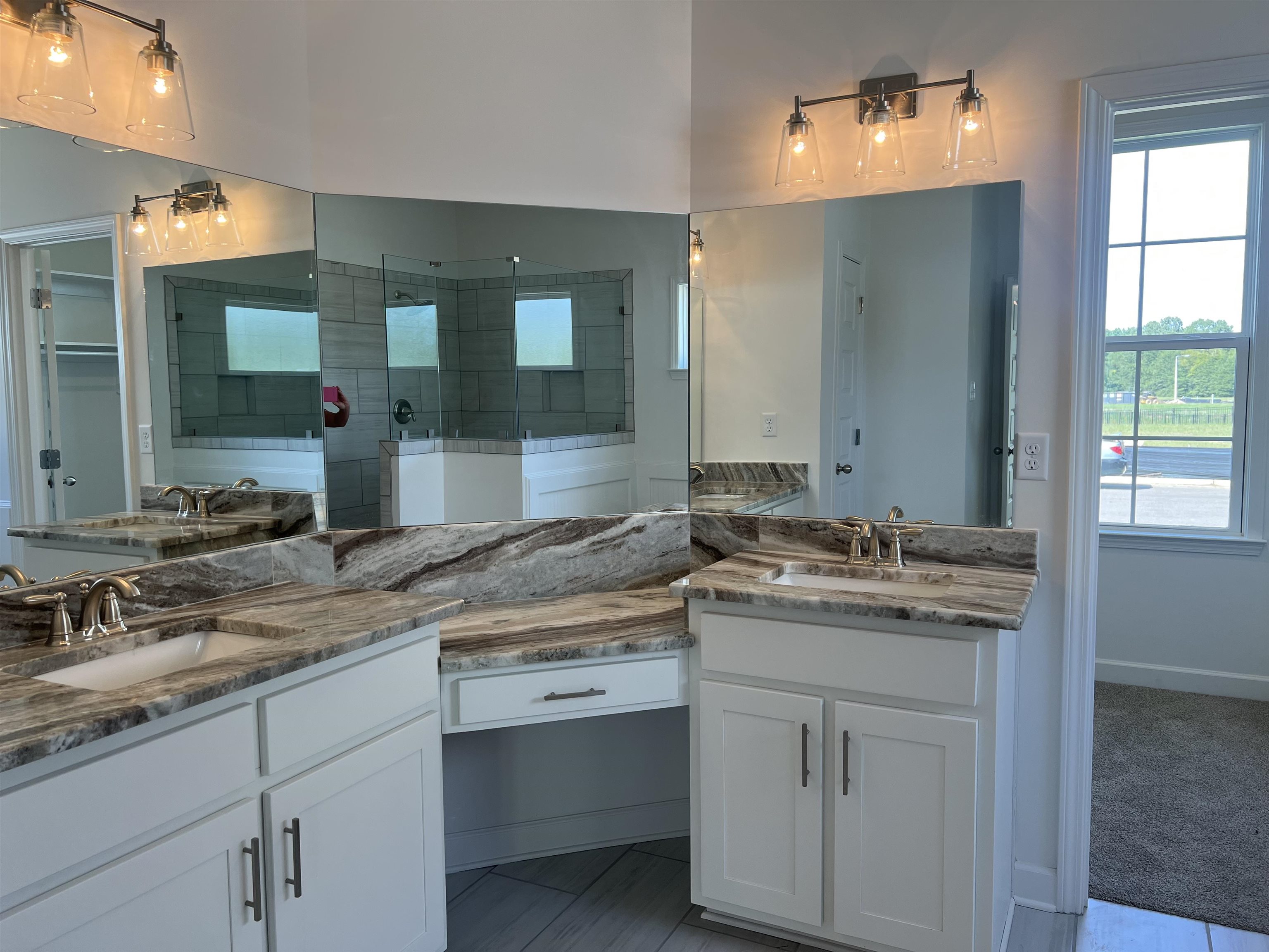 45 Rolling Hill Drive Collierville, TN 38017 - Photo 12 of 24 a bathroom with a sink vanity and mirror
