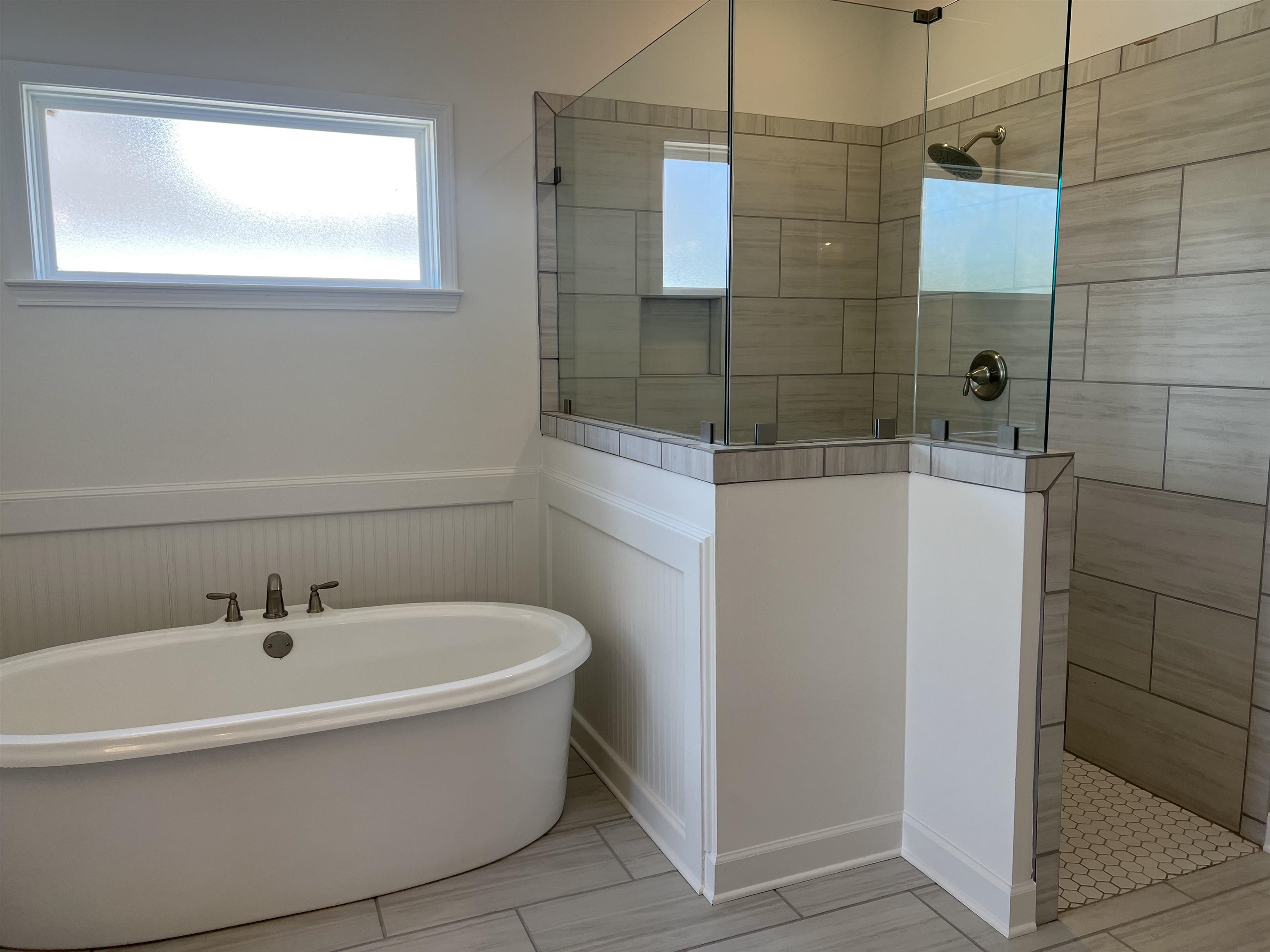 45 Rolling Hill Drive Collierville, TN 38017 - Photo 13 of 24 a white bath tub sitting next to a shower