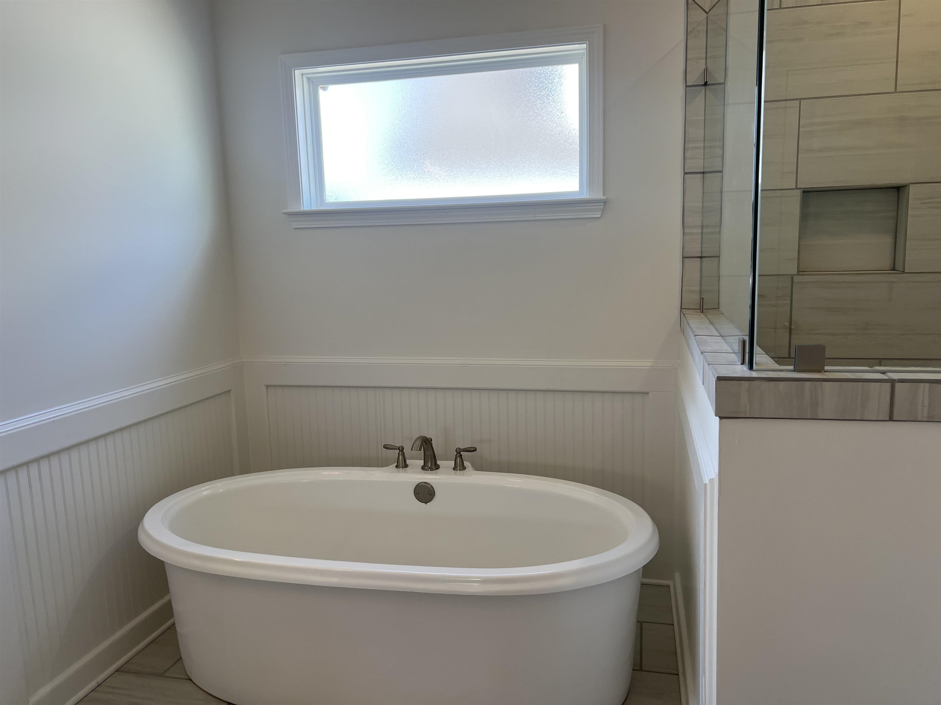 45 Rolling Hill Drive Collierville, TN 38017 - Photo 14 of 24 a white bath tub sitting in a bathroom