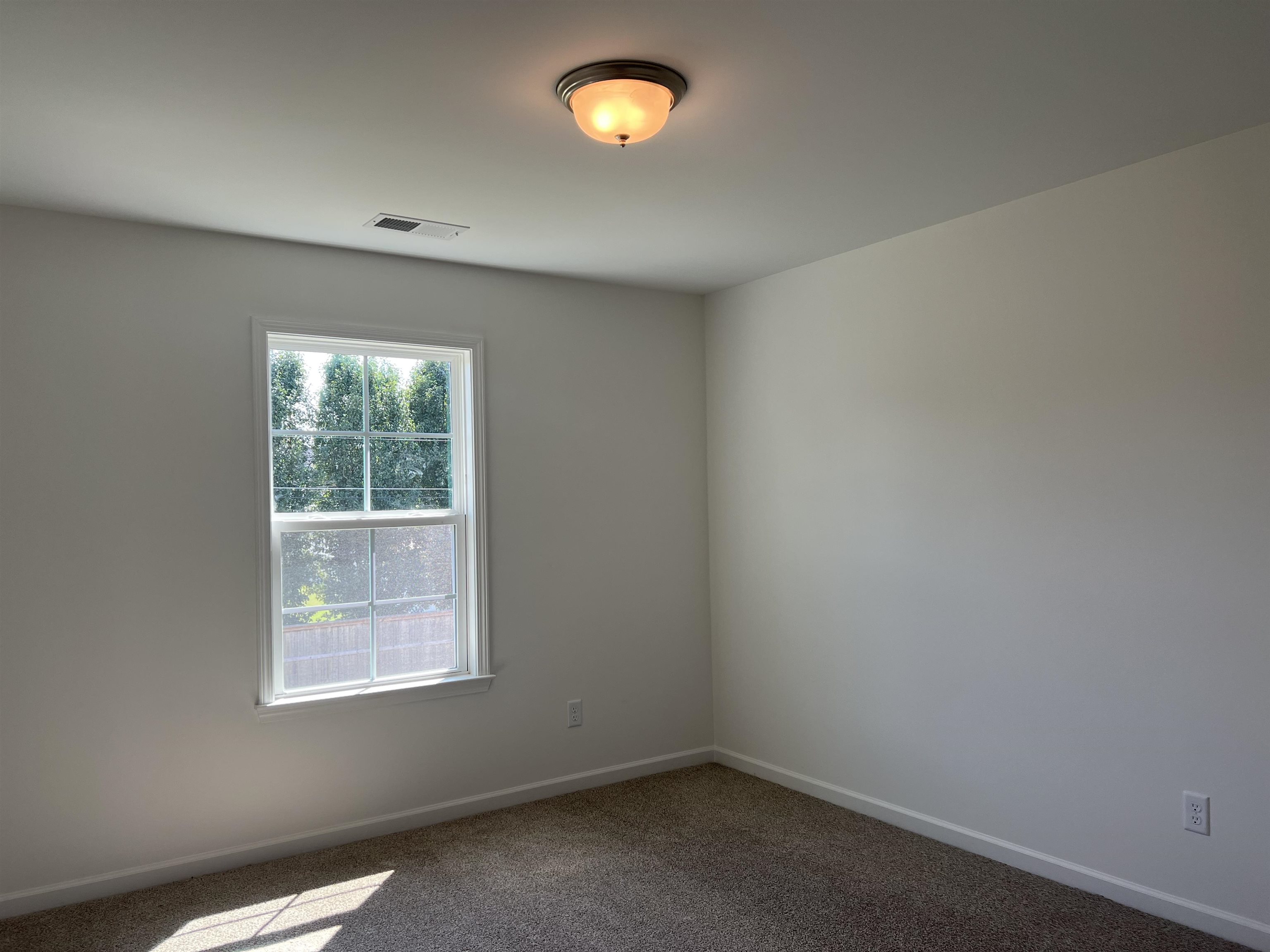 45 Rolling Hill Drive Collierville, TN 38017 - Photo 20 of 24 an empty room with a window