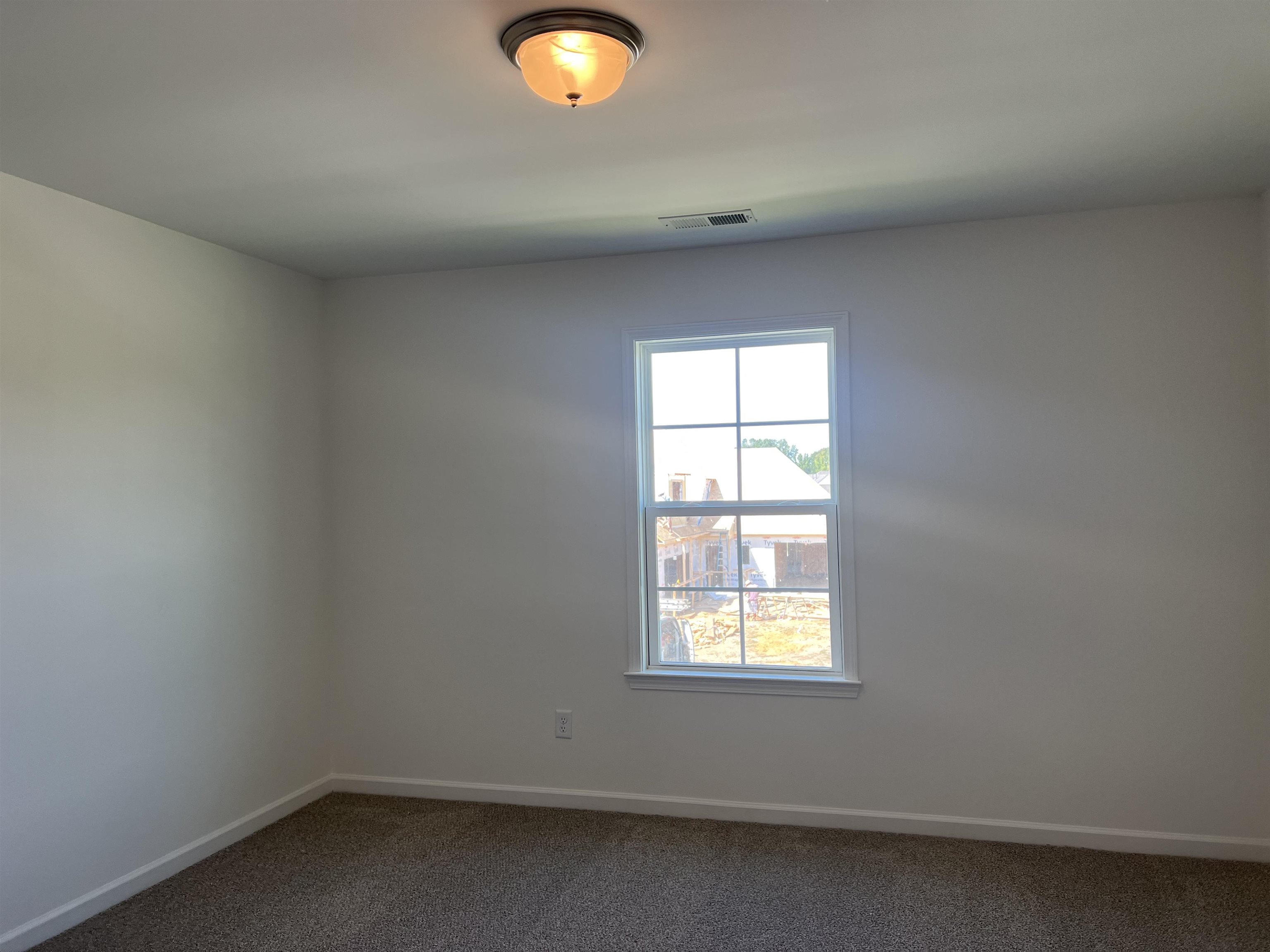 45 Rolling Hill Drive Collierville, TN 38017 - Photo 22 of 24 an empty room with a window