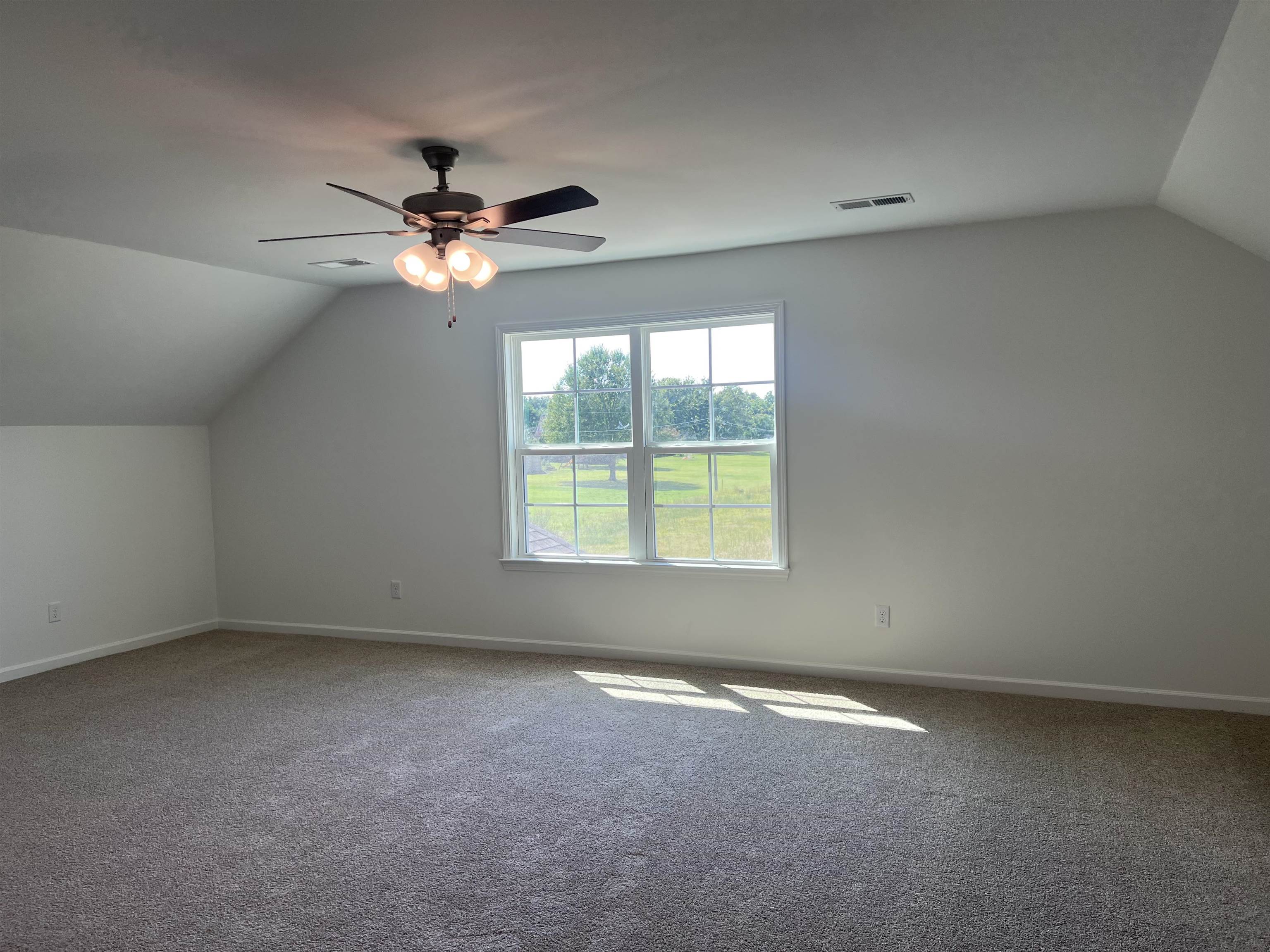 45 Rolling Hill Drive Collierville, TN 38017 - Photo 23 of 24 an empty room with a window and a fan