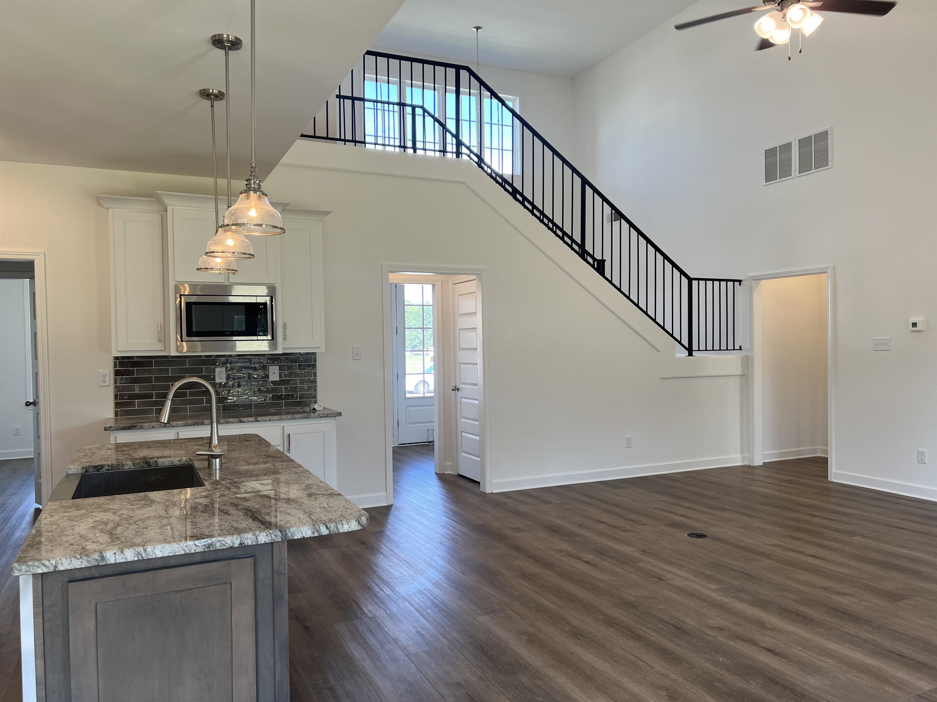 45 Rolling Hill Drive Collierville, TN 38017 - Photo 6 of 24 a view of a kitchen cabinets and a wooden floor