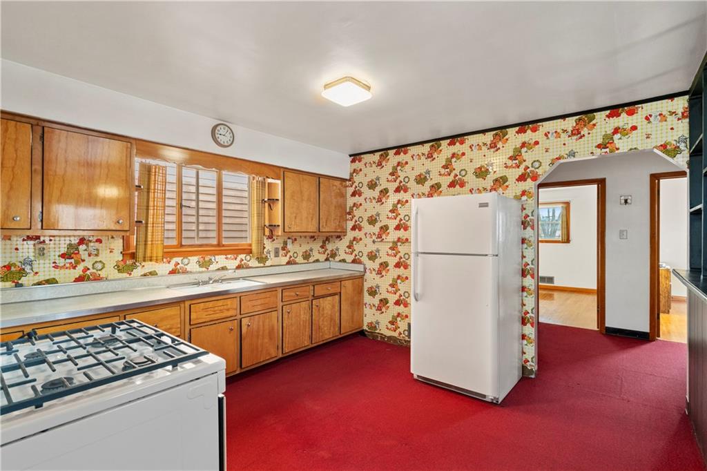 306 Allegheny Street Tarentum, PA 15084 - Photo 3 of 10 a kitchen with refrigerator and cabinets