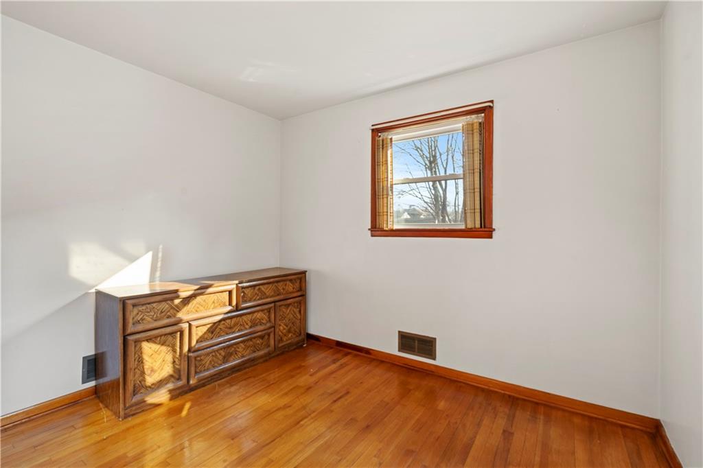 306 Allegheny Street Tarentum, PA 15084 - Photo 5 of 10 a view of room with wooden floor and cabinet