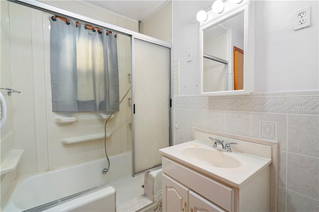306 Allegheny Street Tarentum, PA 15084 - Photo 7 of 10 a bathroom with a sink toilet and shower