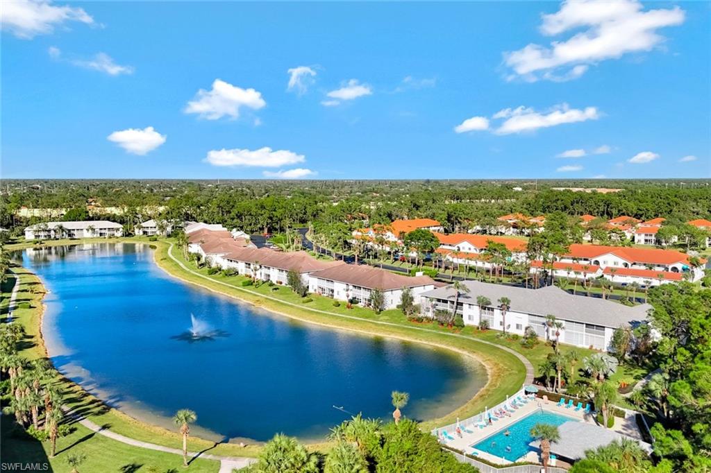 409 Gabriel Circle, Unit 2203 Naples, FL 34104 - Photo 23 of 24 Community pool with a lake view