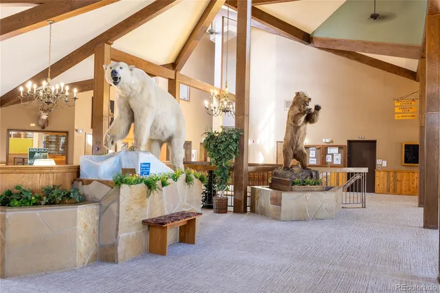 a view of a patio with couches and potted plants