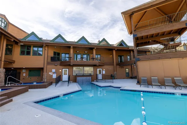 a view of a house with a yard patio and a patio