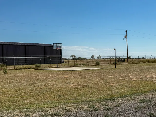 a kitchen with a sink a cabinets and window