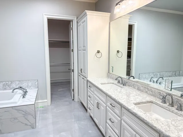 a bathroom with a shower curtain and a shower