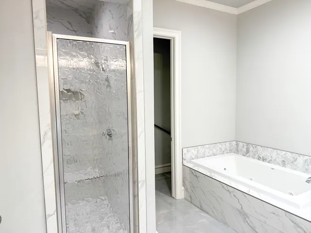 a bathroom with a granite countertop sink and vanity