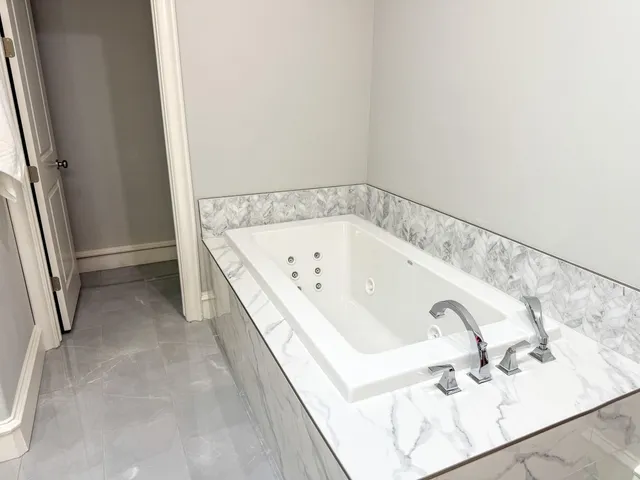 a bathroom with a shower and a sink