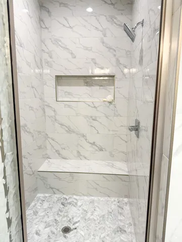 a view of an empty room with a fireplace