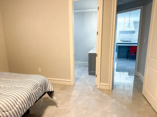 a living room with lots of furniture and a wooden floor